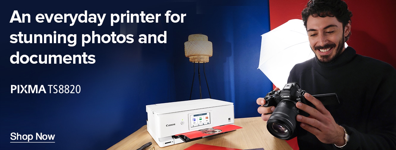 Canon PIXMA TS8820 printer banner showing compact white printer producing photo prints on a desk with camera and studio lighting, promoting everyday photo and document printing with shop now call to action