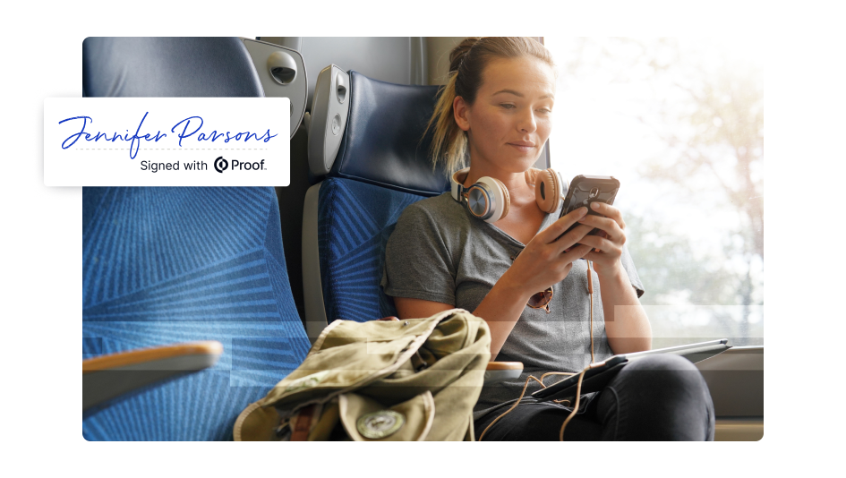 Notarize Any Document 100% Online Notarize any document from home, work, or on the go. Get Started.Image shows a person seated on public transportation using a mobile phone, with headphones around their neck. An overlay graphic displays the name Jennifer Parsons and the text Signed with Proof, representing a completed online notarization.