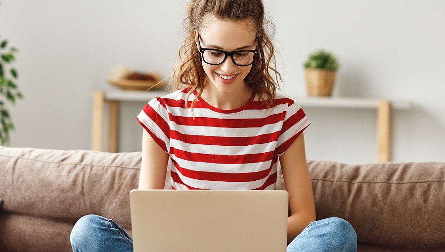 Person using a laptop on a couch